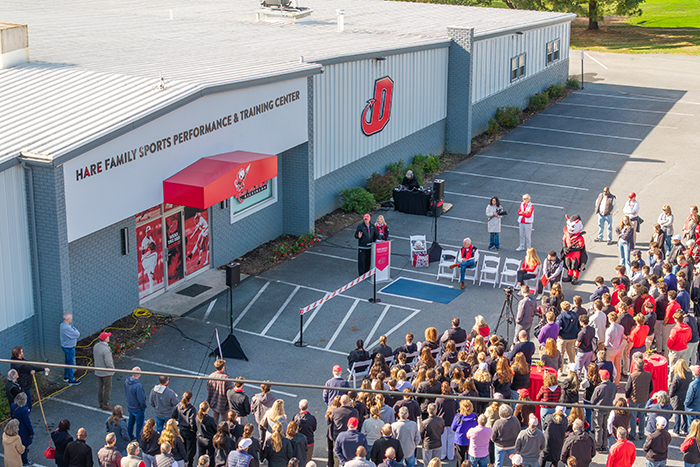 A crowd attending the opening of the HARE FAMILY SPORTS PERFORMANCE & TRAINING CENTER